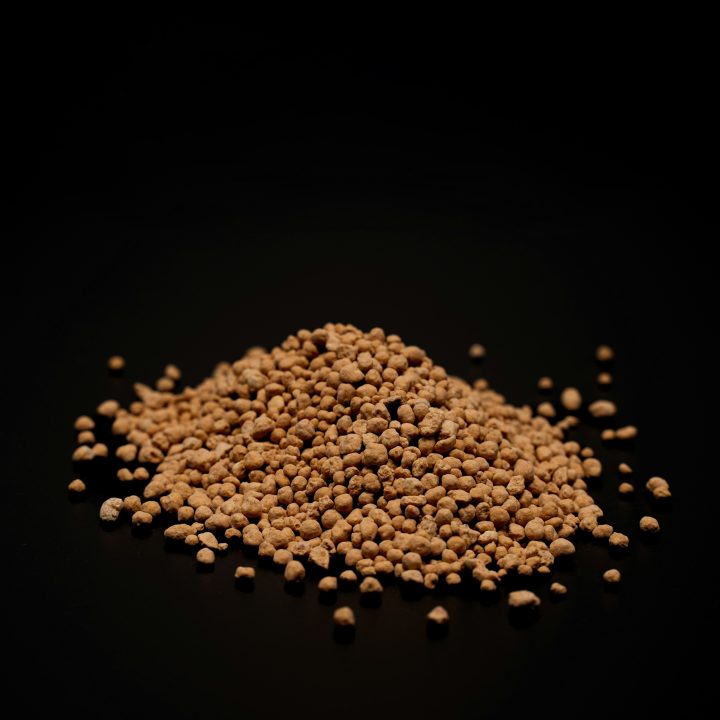 brown granules on a black background